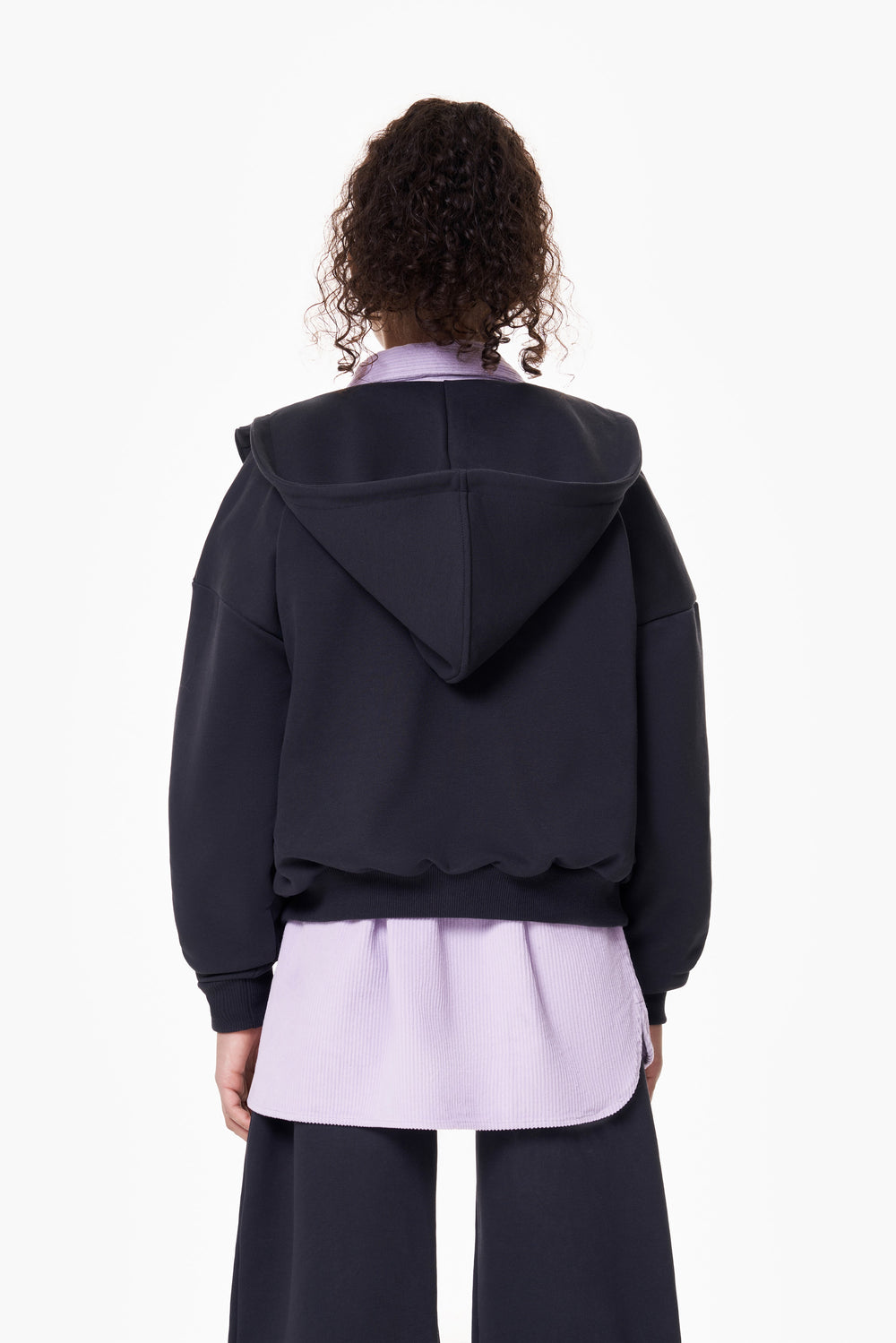Girl wearing the ON7 Zip Hoodie in graphite, view 3 of 5