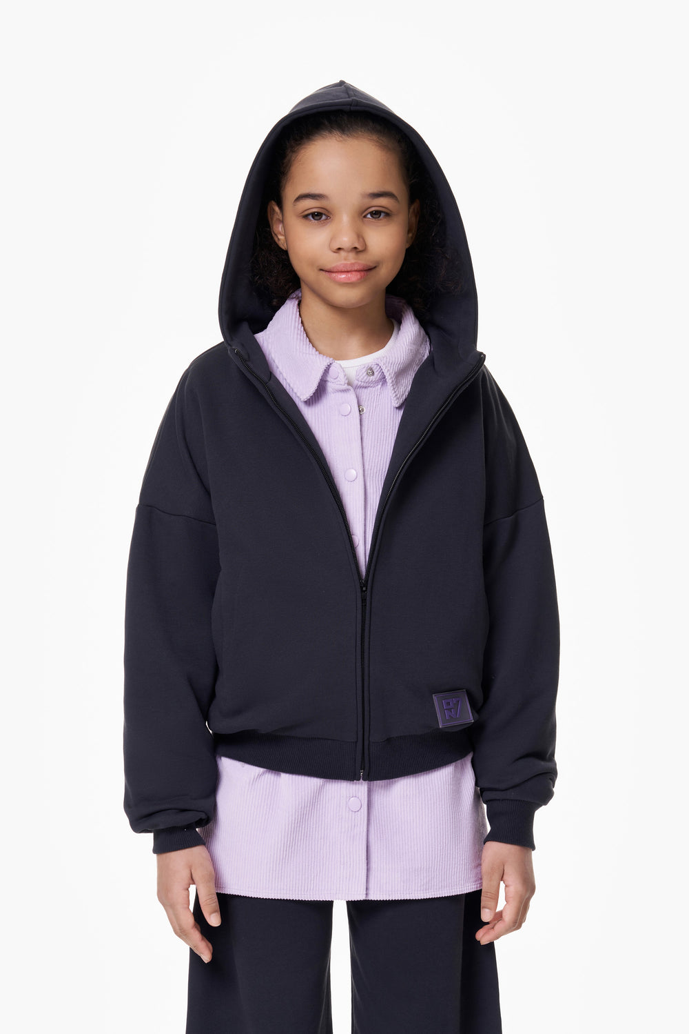 Girl wearing the ON7 Zip Hoodie in graphite, view 5 of 5