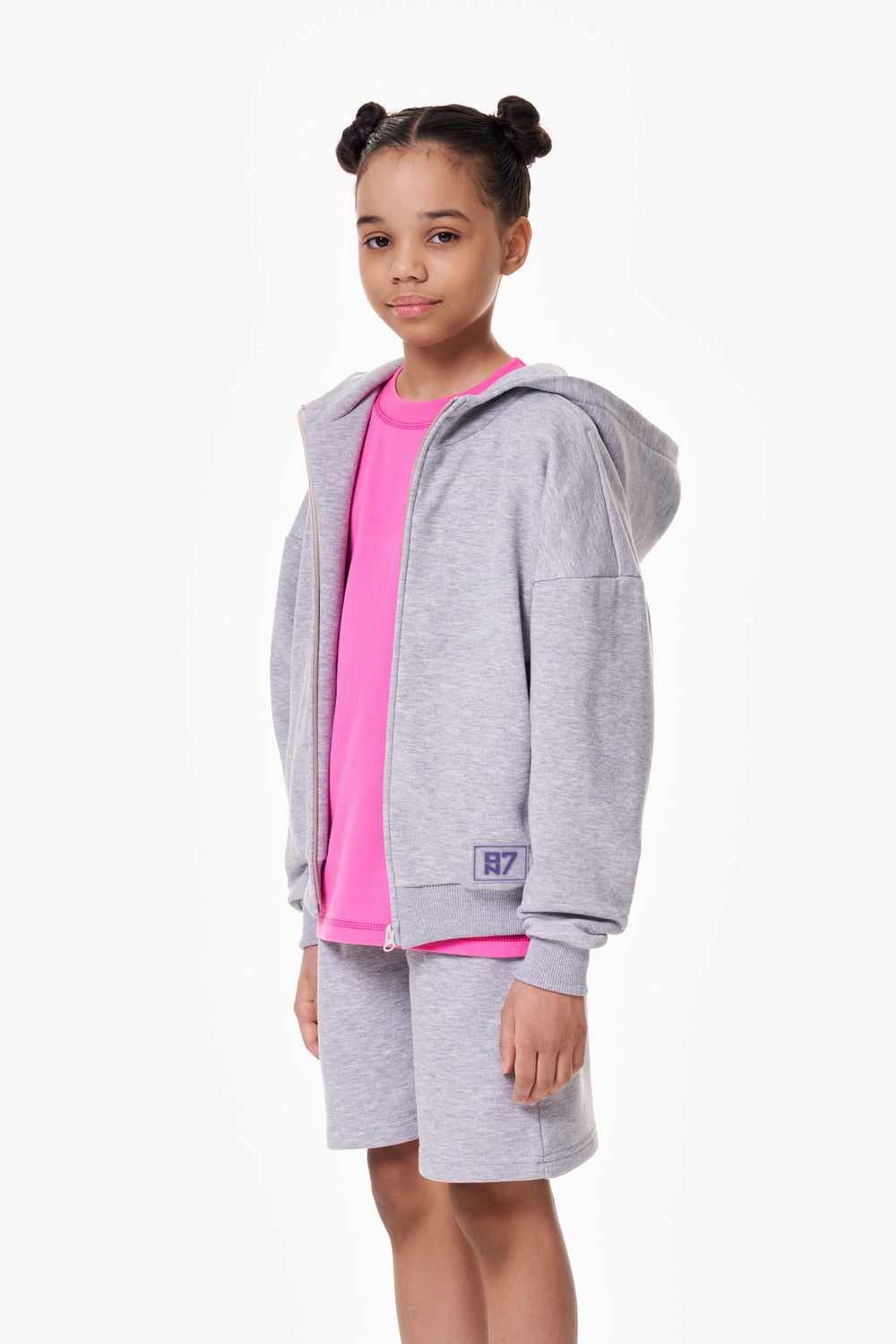 Girl wearing the ON7 Zip Hoodie in melange, view 2 of 4