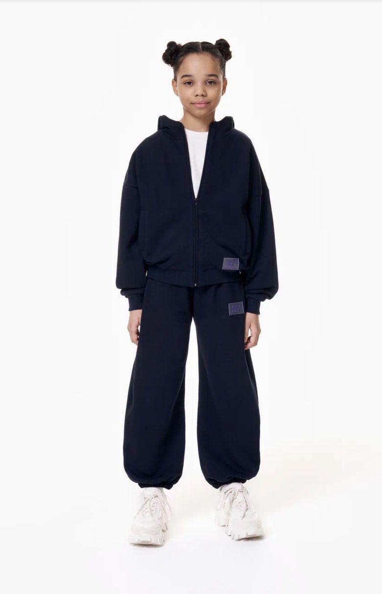 Child wearing the ON7 Weekend Set - matching kids hoodie and joggers in cotton futer, designed in Dubai